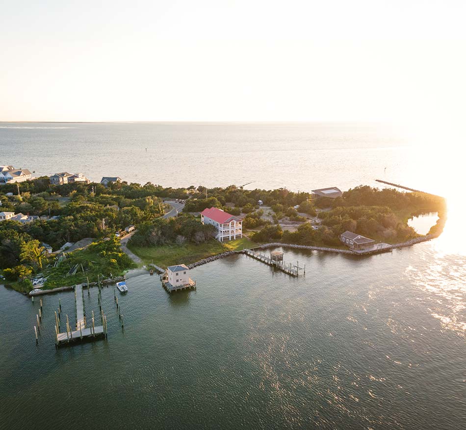 Aerial view of Silver Lake harbor and Ocracoke village on Ocracoke Island, North Carolina at golden hour.